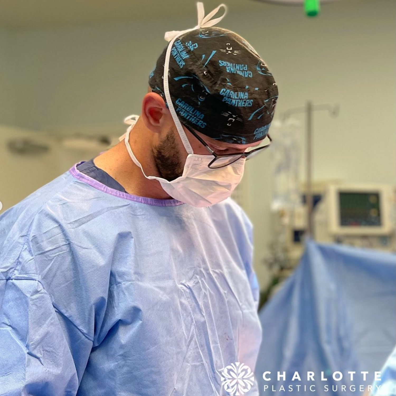 Surgeon in scrubs preparing for a procedure.